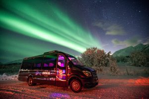 mercedes 17 seater minibus with northern lights background, Arctic Adventure Center